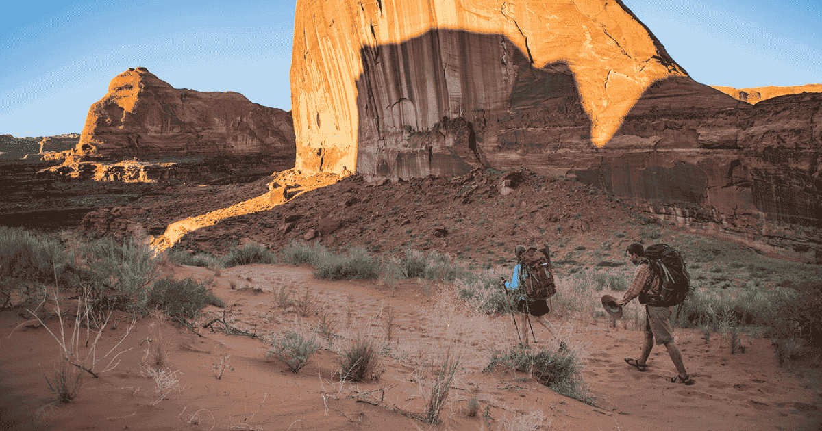 erics friends walking through coyote gulch backpacking and hiking adventures