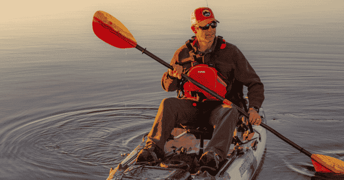 ken whiting using a sit on top kayak with an aquabound paddle on the water kayaking