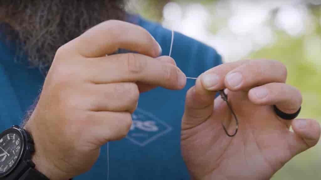 Step 5 - Wrap the tag end around the line five times 
