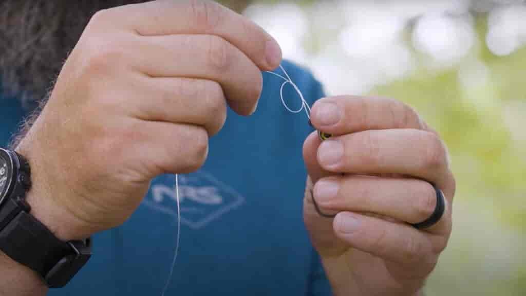 Step 3 - Pass the tag end back through the overhand knot