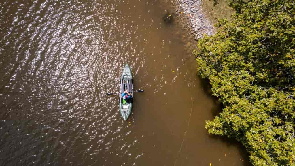 Working the shoreline of Watts Bar Lake fishing in an inflatable kayak.
