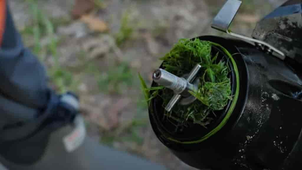 A quick un screwing of the cap and you can get at any excess grass trapped and slowing you down.