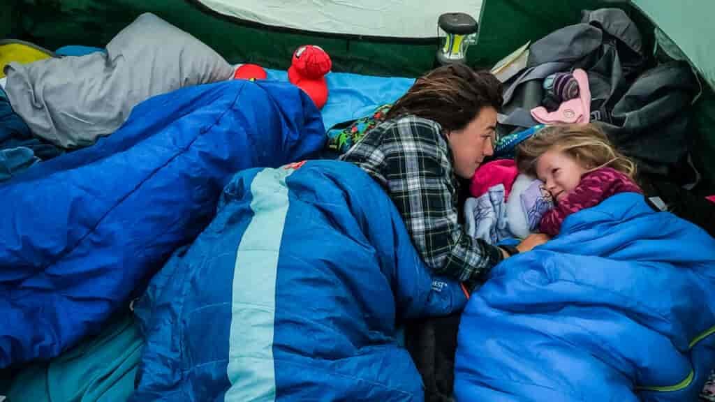 Comfort on a camping trip can be accomplished by bring something familiar from home. Like a Barbie pillow.