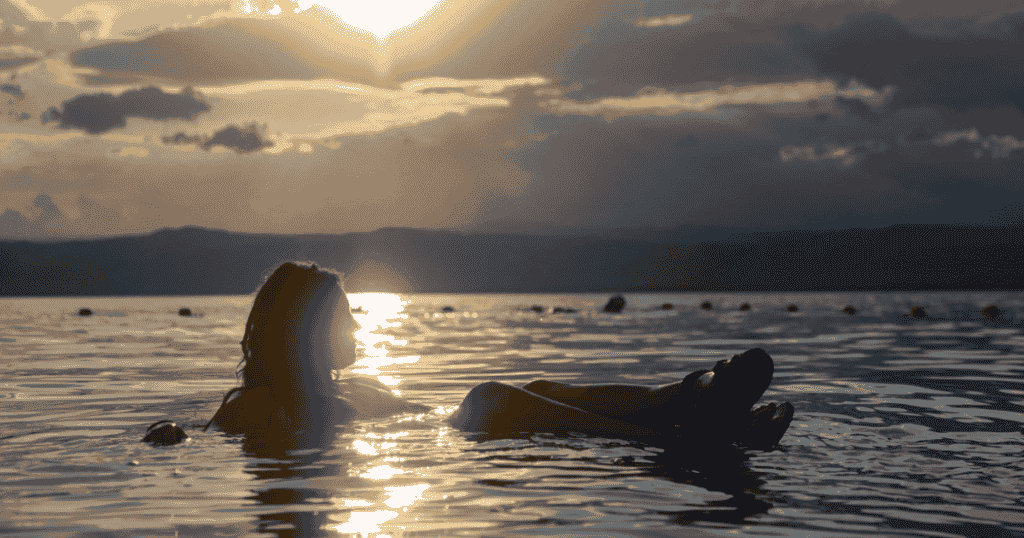 emily jackson floating in the dead sea in aqaba jordan on an adventure