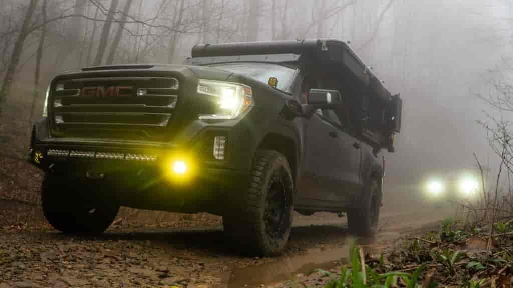 GMC Sierra with the Four Wheel Camper Project M | Georgia Traverse Overland Trip, foggy shot of truck with lights on during the Georgia Traverse