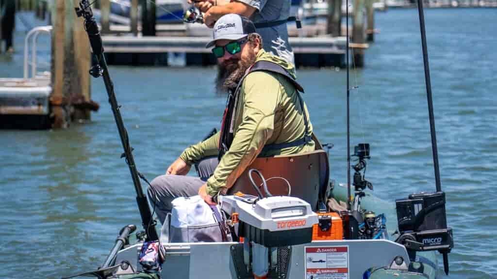 Man sitting on the Sea Eagle FishSkiff 16 inflatable fishing boat